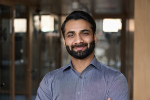 headshot of a man in an office