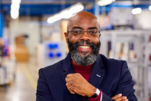 headshot of a man in an office