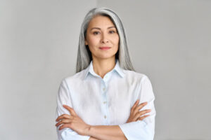 headshot of woman on gray background