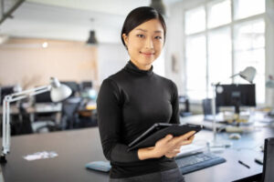 woman holding ipad