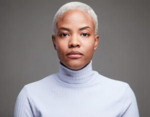 Headshot of woman in purple turtleneck