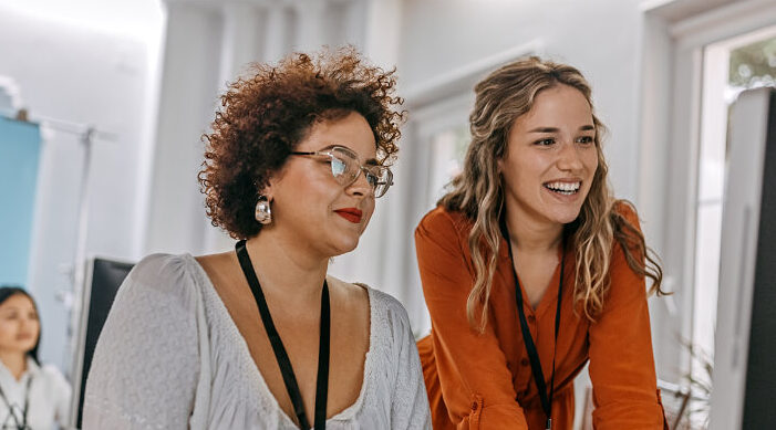 Two women at their computer