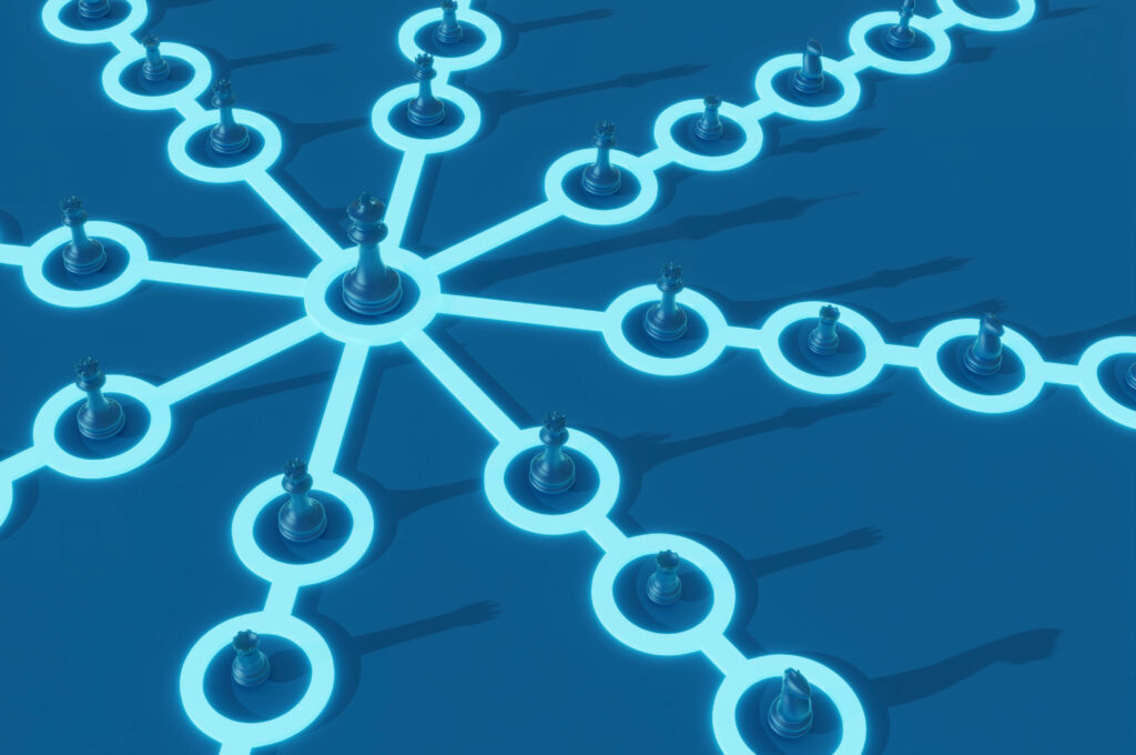 3D rendering of chess pieces on a board all leading to one unified piece symbolizing the structure and efficiency that Managed Print Services brings to a company.
