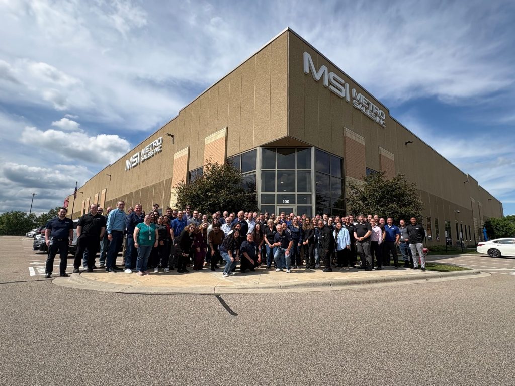 The Metro Sales team gathered outside the MSI headquarters building