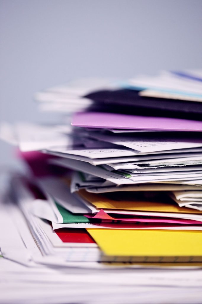Stack of colorful paper files and folders
