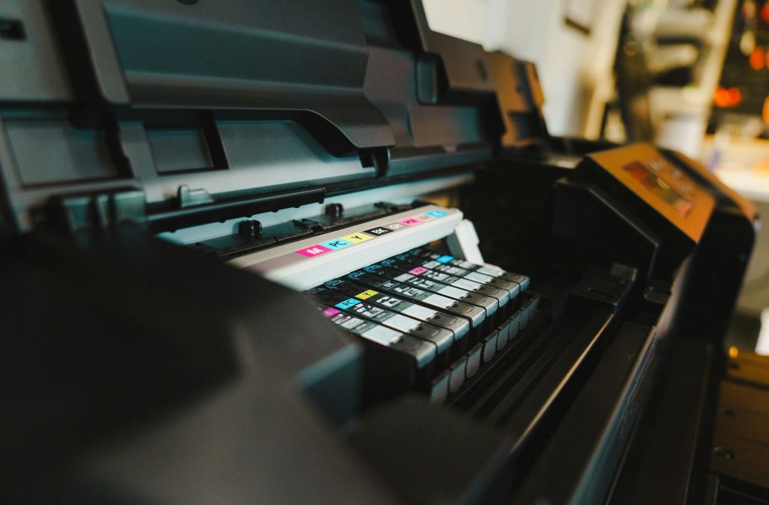 Close-up of ink cartridges inside a digital press