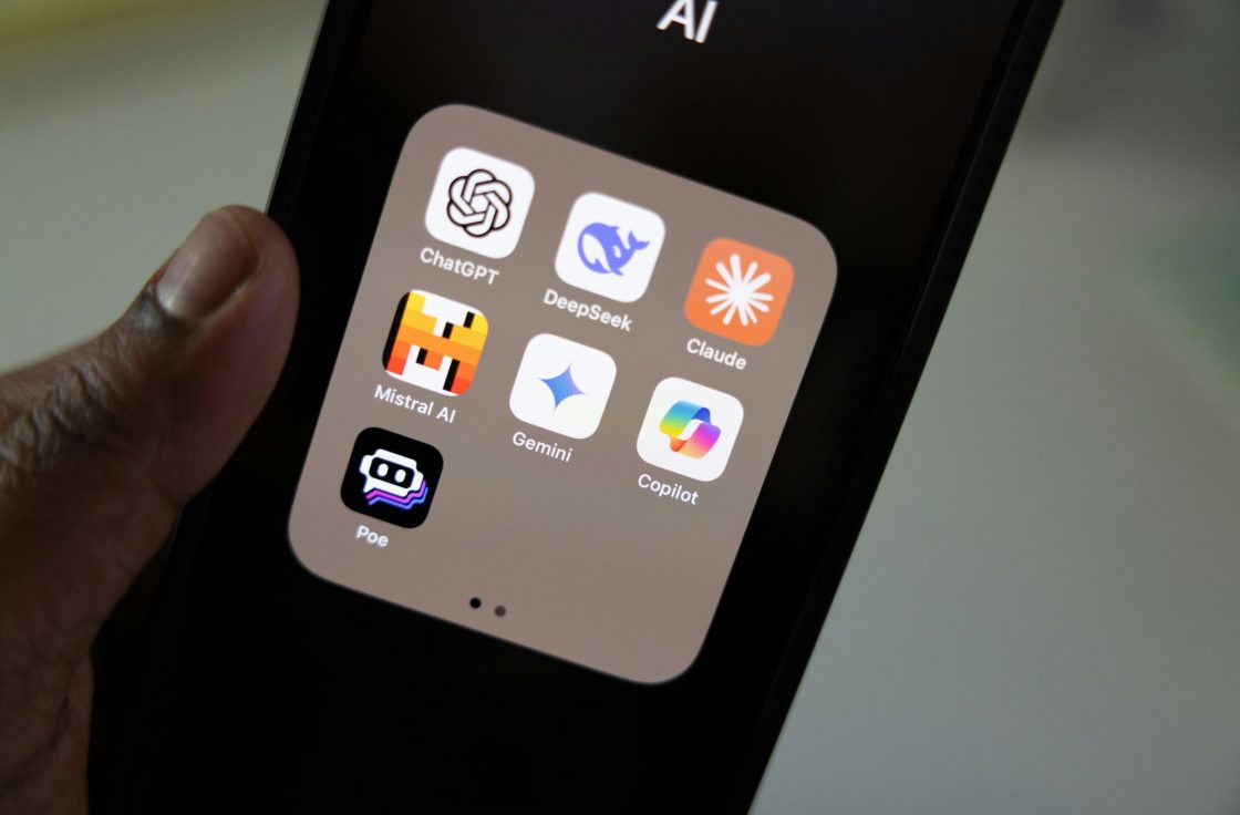 Phone screen showing a folder of AI assistant apps